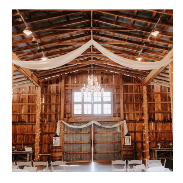 interior of barn wedding venue with chandelier